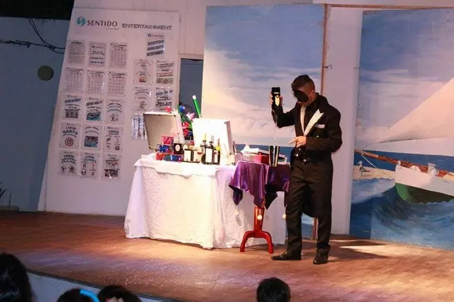 magician-performing-magic-on-stage